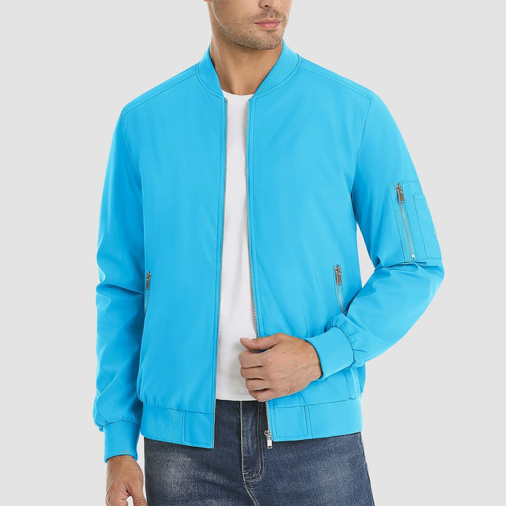 "Blouson bomber léger homme printanier, fermeture éclair, coupe moderne, tissu respirant, couleur bleu royal vibrant."