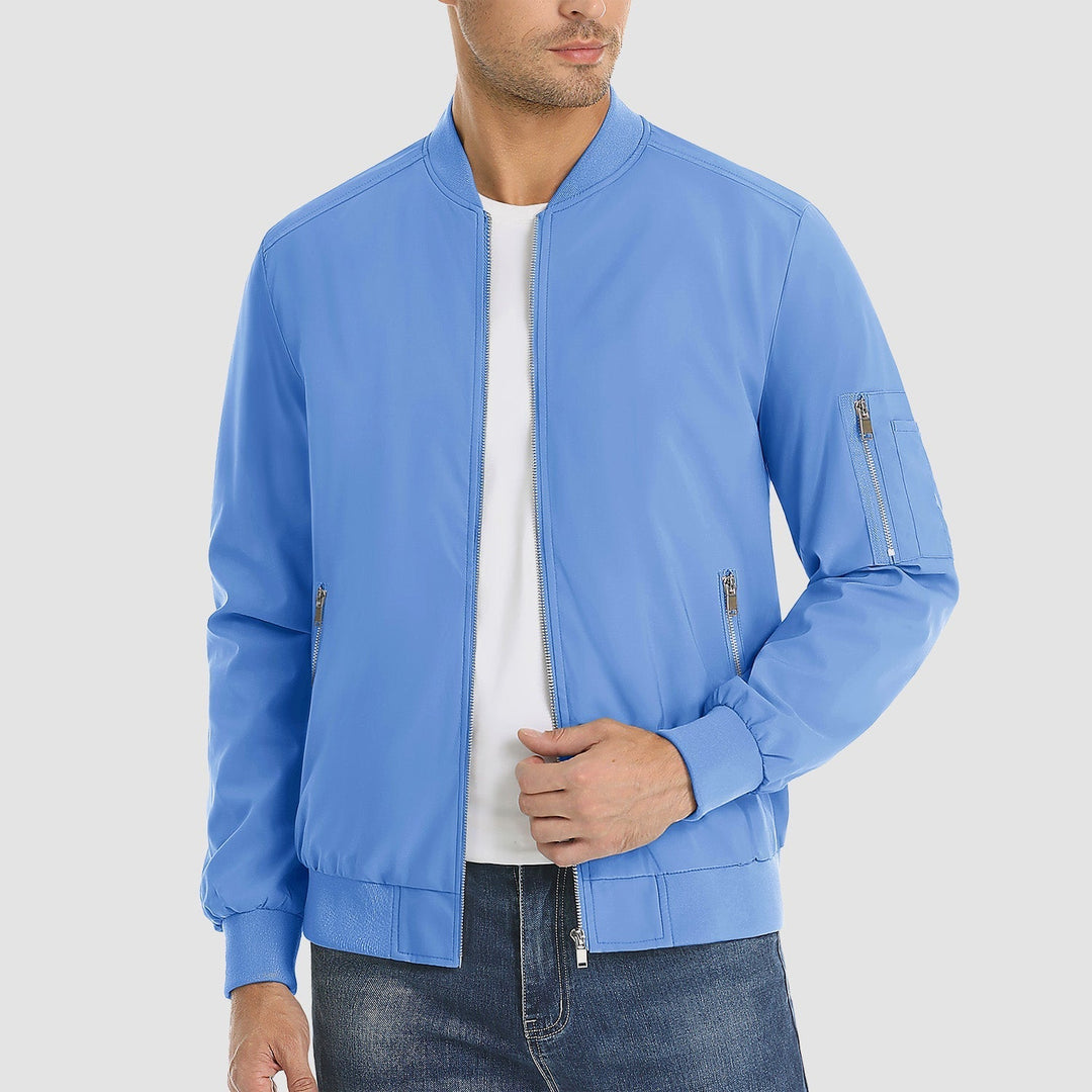 "Blouson bomber léger homme printanier, fermeture éclair, coupe moderne, tissu respirant, couleur bleu royal vibrant."