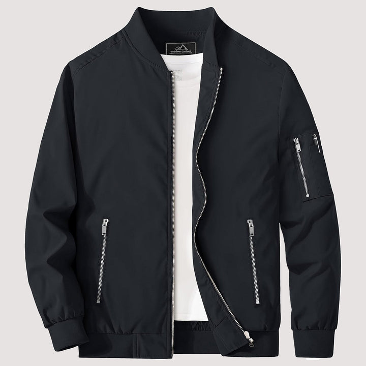 "Blouson bomber léger homme printanier, fermeture éclair, coupe moderne, tissu respirant, couleur bleu royal vibrant."