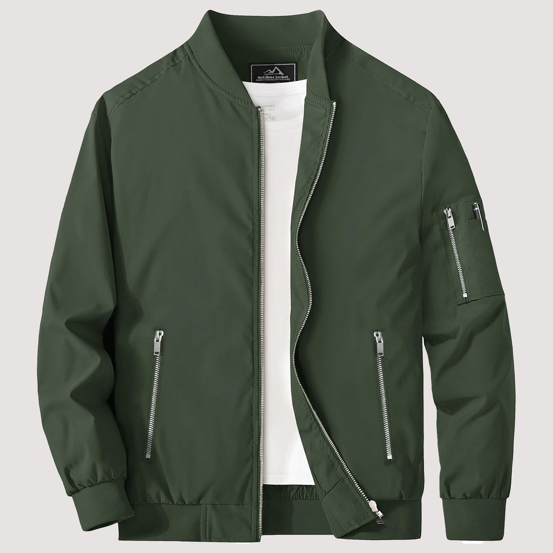"Blouson bomber léger homme printanier, fermeture éclair, coupe moderne, tissu respirant, couleur bleu royal vibrant."