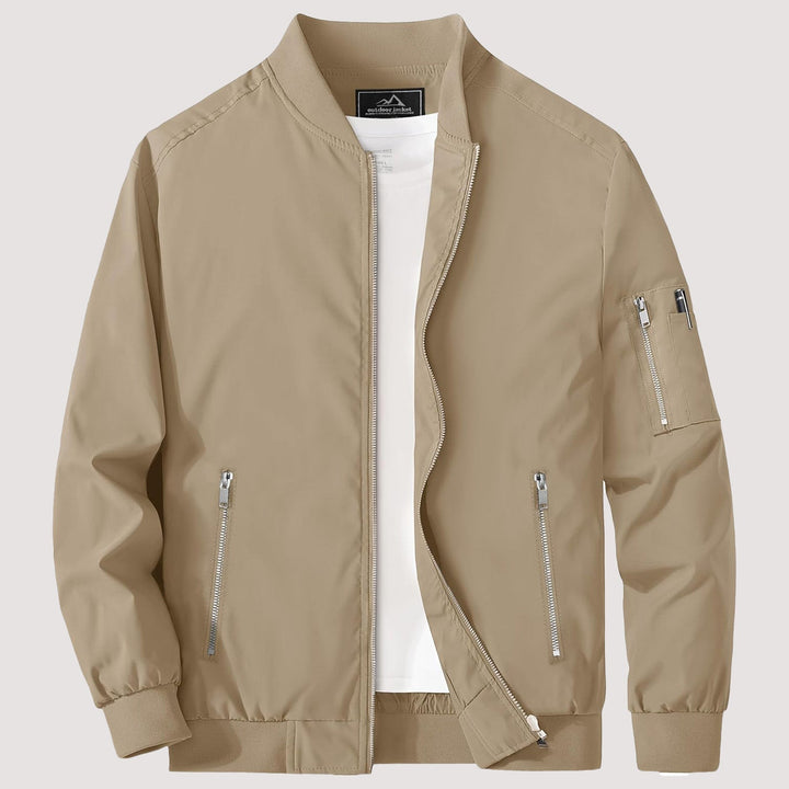"Blouson bomber léger homme printanier, fermeture éclair, coupe moderne, tissu respirant, couleur bleu royal vibrant."
