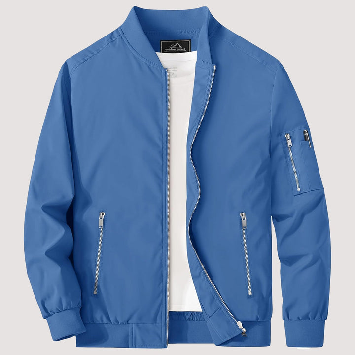 "Blouson bomber léger homme printanier, fermeture éclair, coupe moderne, tissu respirant, couleur bleu royal vibrant."