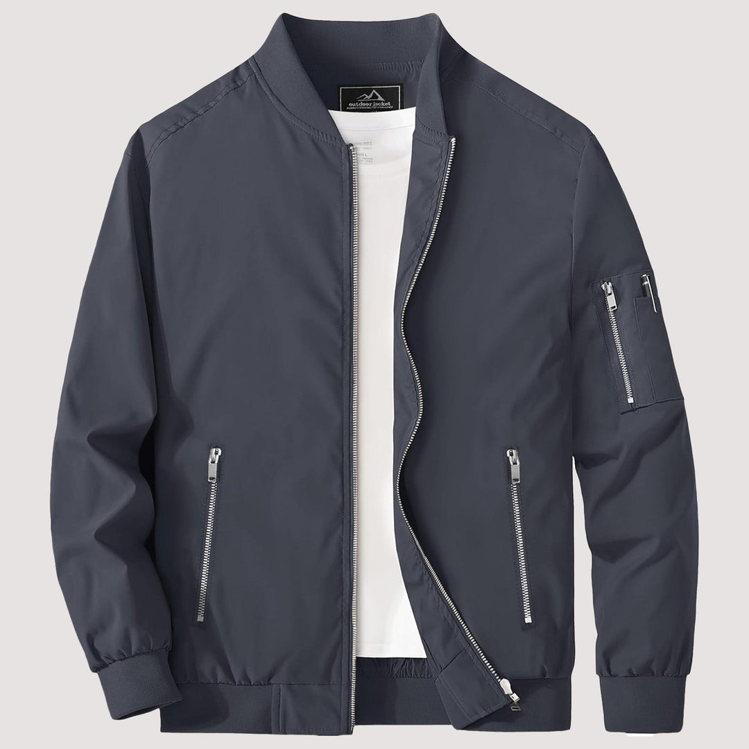 "Blouson bomber léger homme printanier, fermeture éclair, coupe moderne, tissu respirant, couleur bleu royal vibrant."