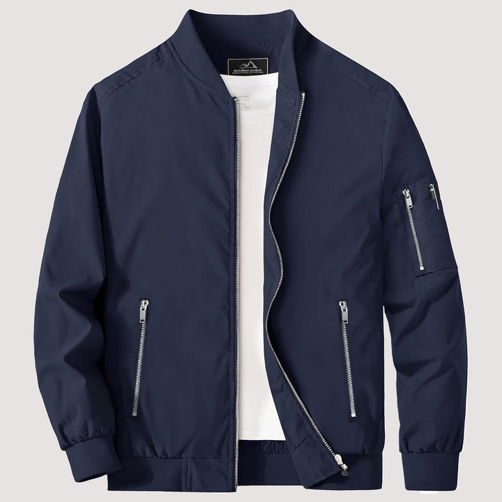 "Blouson bomber léger homme printanier, fermeture éclair, coupe moderne, tissu respirant, couleur bleu royal vibrant."