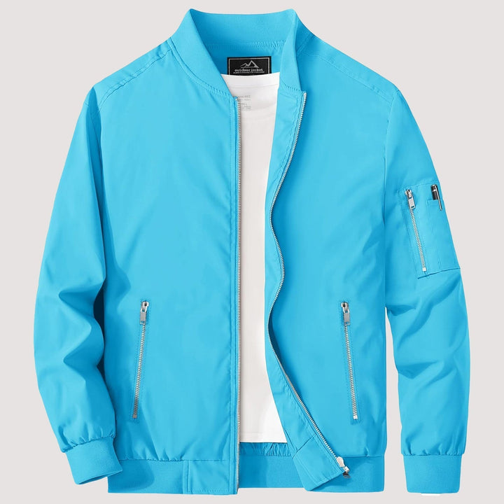 "Blouson bomber léger homme printanier, fermeture éclair, coupe moderne, tissu respirant, couleur bleu royal vibrant."