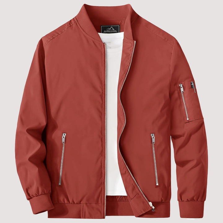 "Blouson bomber léger homme printanier, fermeture éclair, coupe moderne, tissu respirant, couleur bleu royal vibrant."