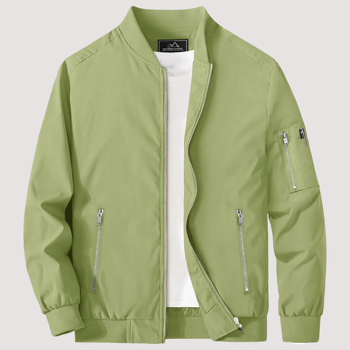 "Blouson bomber léger homme printanier, fermeture éclair, coupe moderne, tissu respirant, couleur bleu royal vibrant."