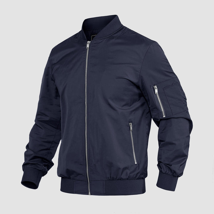 "Blouson bomber léger homme printanier, fermeture éclair, coupe moderne, tissu respirant, couleur bleu royal vibrant."