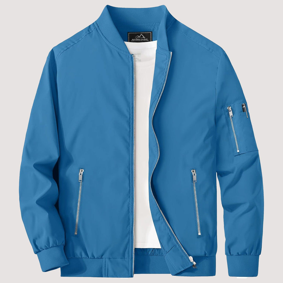 "Blouson bomber léger homme printanier, fermeture éclair, coupe moderne, tissu respirant, couleur bleu royal vibrant."