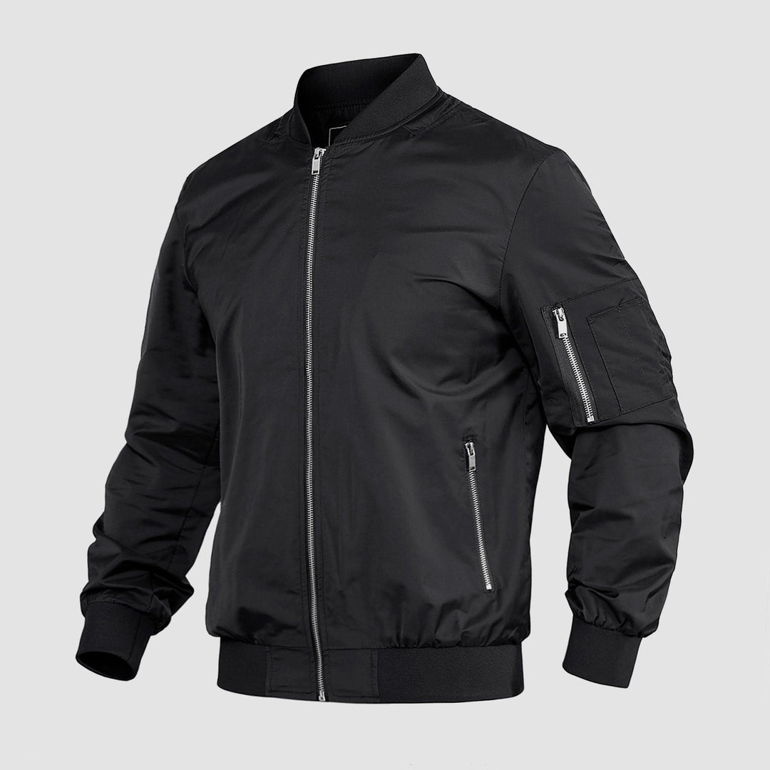 "Blouson bomber léger homme printanier, fermeture éclair, coupe moderne, tissu respirant, couleur bleu royal vibrant."