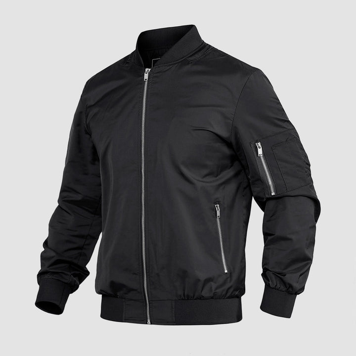 "Blouson bomber léger homme printanier, fermeture éclair, coupe moderne, tissu respirant, couleur bleu royal vibrant."