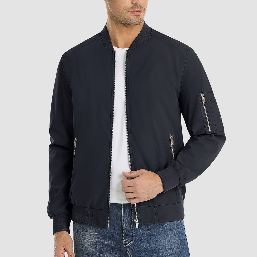 "Blouson bomber léger homme printanier, fermeture éclair, coupe moderne, tissu respirant, couleur bleu royal vibrant."