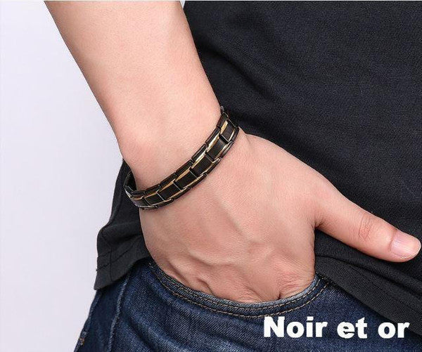 "Bracelet magnétique élégant en noir et argent, avec pierres ocre, offrant équilibre énergétique et bienfaits thérapeutiques.
