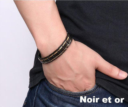 "Bracelet magnétique élégant en noir et argent, avec pierres ocre, offrant équilibre énergétique et bienfaits thérapeutiques.