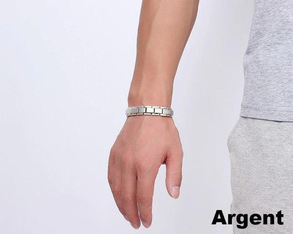 "Bracelet magnétique élégant en noir et argent, avec pierres ocre, offrant équilibre énergétique et bienfaits thérapeutiques.