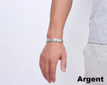 "Bracelet magnétique élégant en noir et argent, avec pierres ocre, offrant équilibre énergétique et bienfaits thérapeutiques.