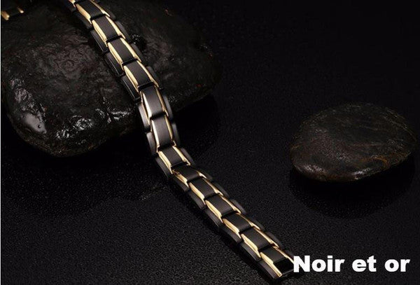 "Bracelet magnétique élégant en noir et argent, avec pierres ocre, offrant équilibre énergétique et bienfaits thérapeutiques.