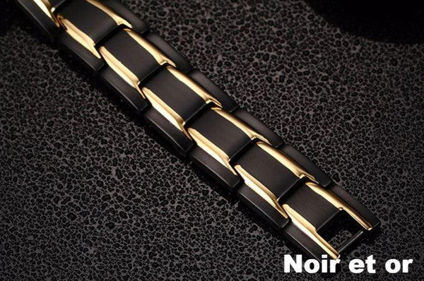 "Bracelet magnétique élégant en noir et argent, avec pierres ocre, offrant équilibre énergétique et bienfaits thérapeutiques.