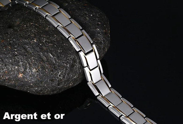 "Bracelet magnétique élégant en noir et argent, avec pierres ocre, offrant équilibre énergétique et bienfaits thérapeutiques.