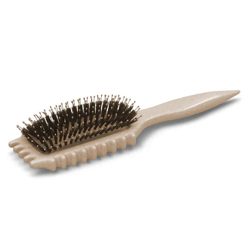 "Brosse coiffante 3-en-1 pour boucles, manche ergonomique, idéale pour dompter frisottis, en blanc laiteux ou vert clair."