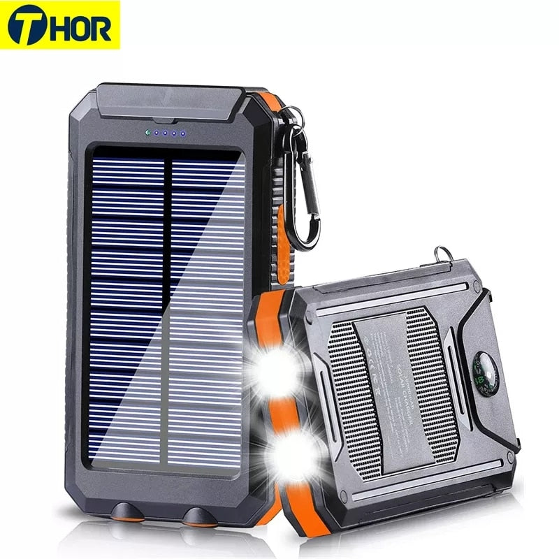 "Chargeur solaire 20000mAh étanche, antichoc, LED intégrée sur fond naturel, idéal pour activités extérieures."