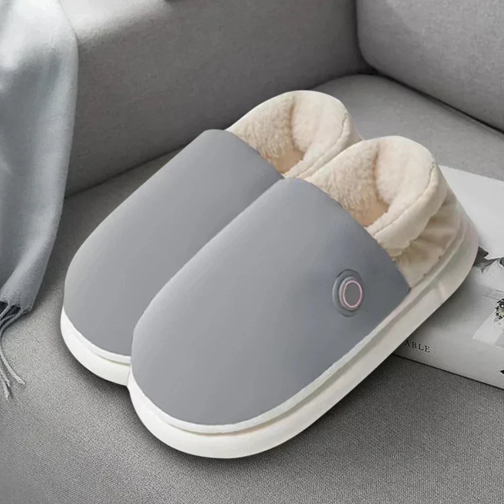 "Chaussons chauffants électriques gris, épais, pour confort et détente en intérieur, avec réglage de température."