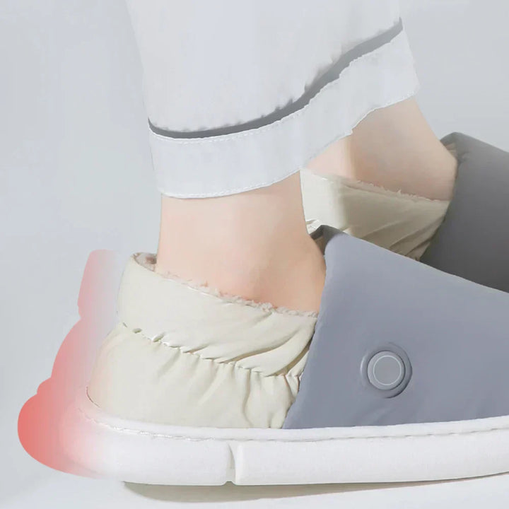 "Chaussons chauffants électriques gris, épais, pour confort et détente en intérieur, avec réglage de température."