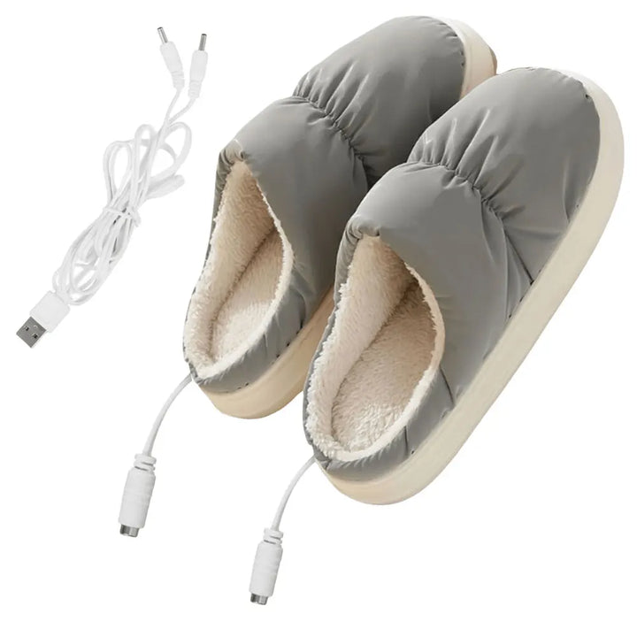 "Chaussons chauffants électriques gris, épais, pour confort et détente en intérieur, avec réglage de température."