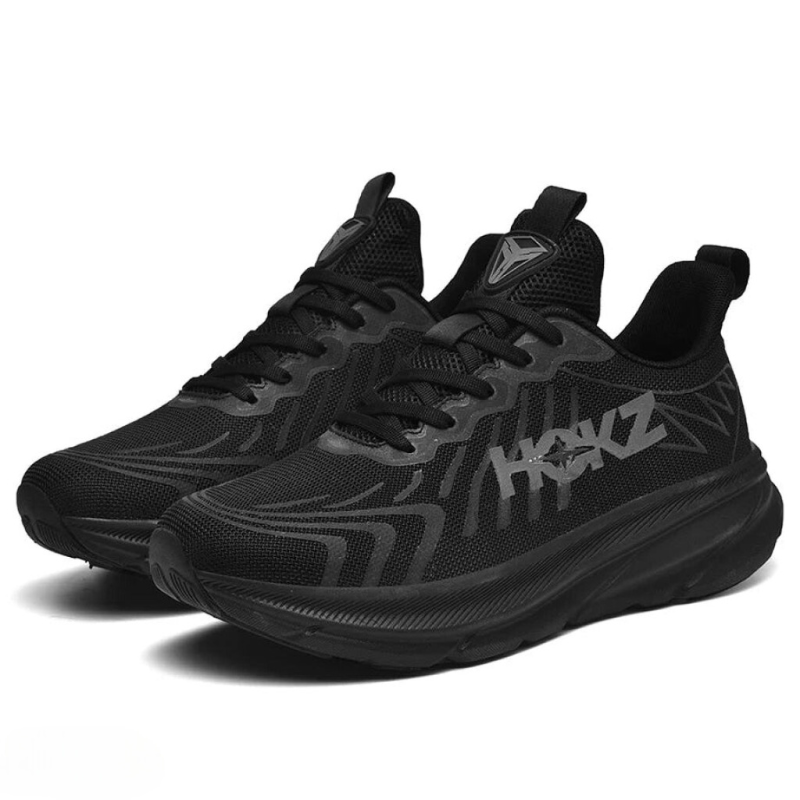 "Chaussures de course légères pour femmes, noir et blanc, avec amorti et design moderne, vue latérale"
