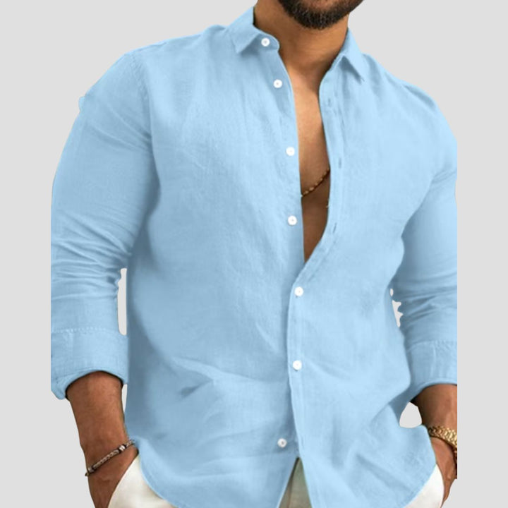 "Chemise en coton homme, léger et respirant, col classique structuré, manches longues retroussables, look décontracté."