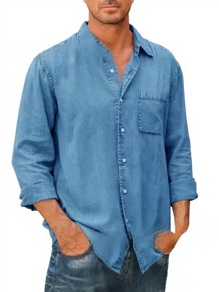 Chemise en jean homme manches longues, style décontracté, coloris bleu marine, tissu léger idéal pour l'été.