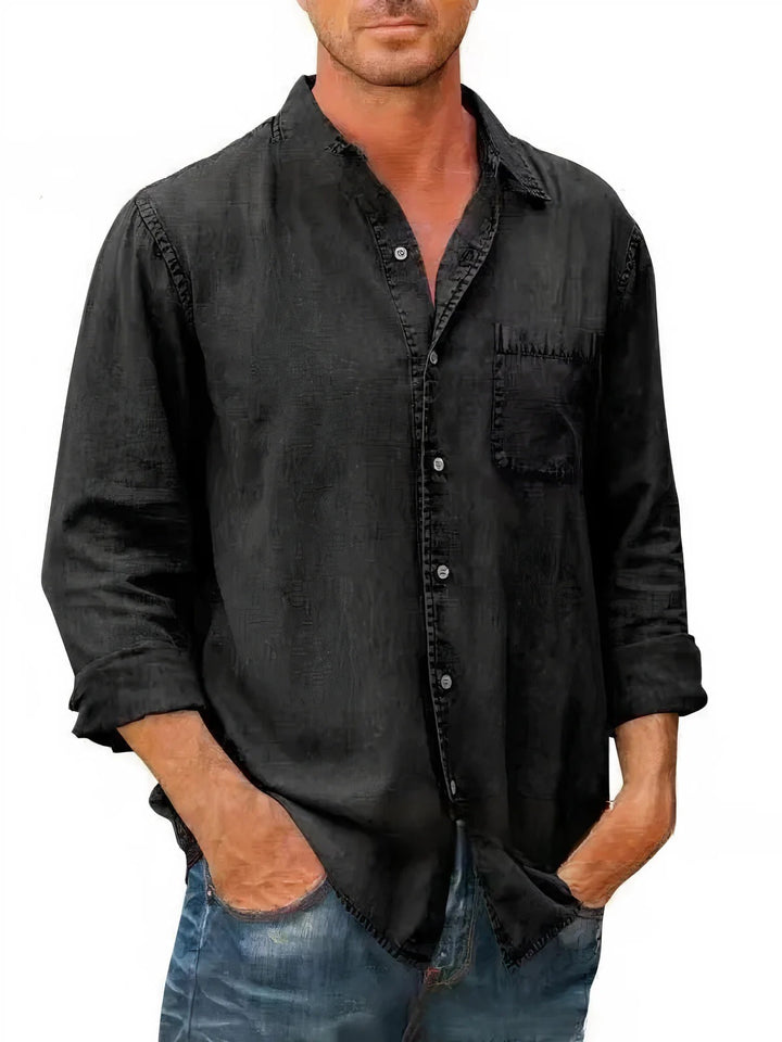 Chemise en jean homme manches longues, style décontracté, coloris bleu marine, tissu léger idéal pour l'été.