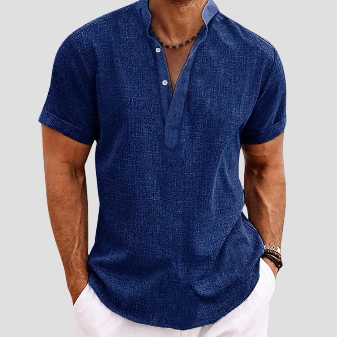 "Chemise en lin décontractée, coupe ample, col mao, manches retroussables, tissu respirant, style estival chic."