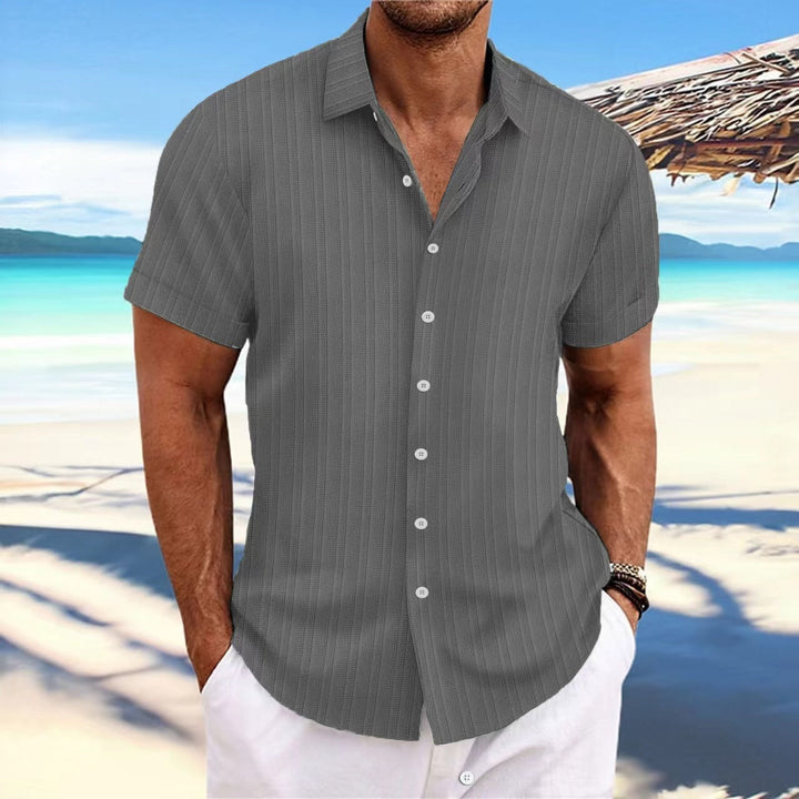 "Chemise homme élégante, manches longues, rayures, coton et lin, idéale pour style formel ou décontracté."