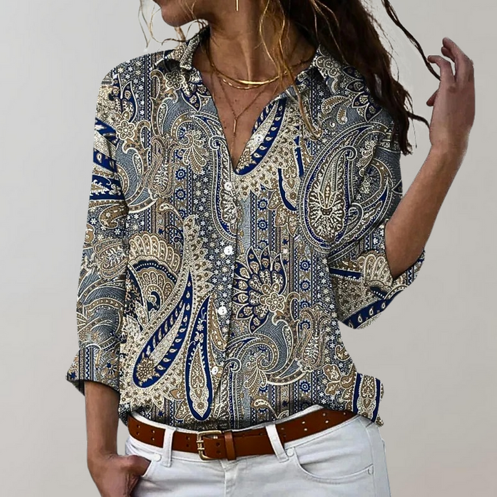 Chemisier femme élégant Lumia, manches longues, imprimés variés, tissu fluide et moderne pour un style polyvalent.