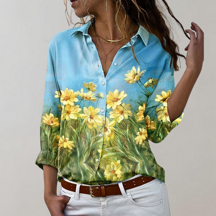Chemisier femme élégant Lumia, manches longues, imprimés variés, tissu fluide et moderne pour un style polyvalent.
