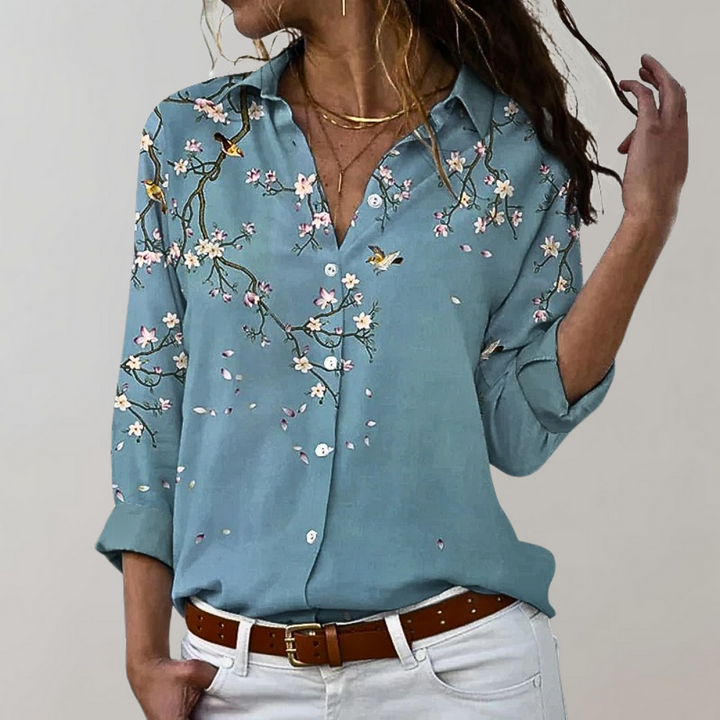Chemisier femme élégant Lumia, manches longues, imprimés variés, tissu fluide et moderne pour un style polyvalent.