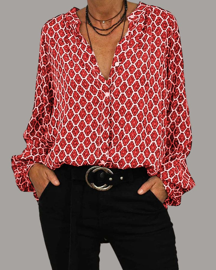 "Chemisier femme en coton, col V élégant, manches longues, motif géométrique, disponible en bleu, noir et rouge."