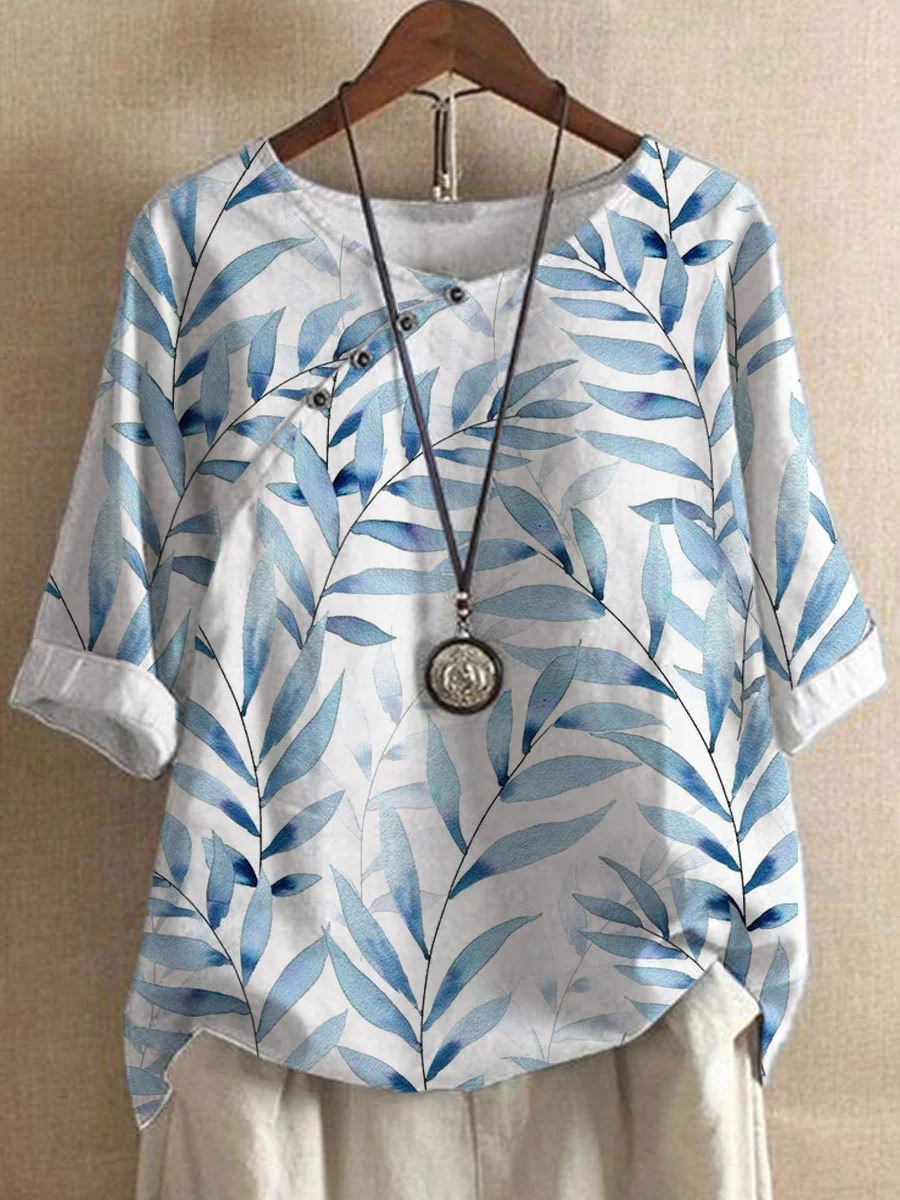 Chemisier femme en lin blanc, imprimé feuilles moderne, léger et élégant pour l'été, style décontracté et sophistiqué.