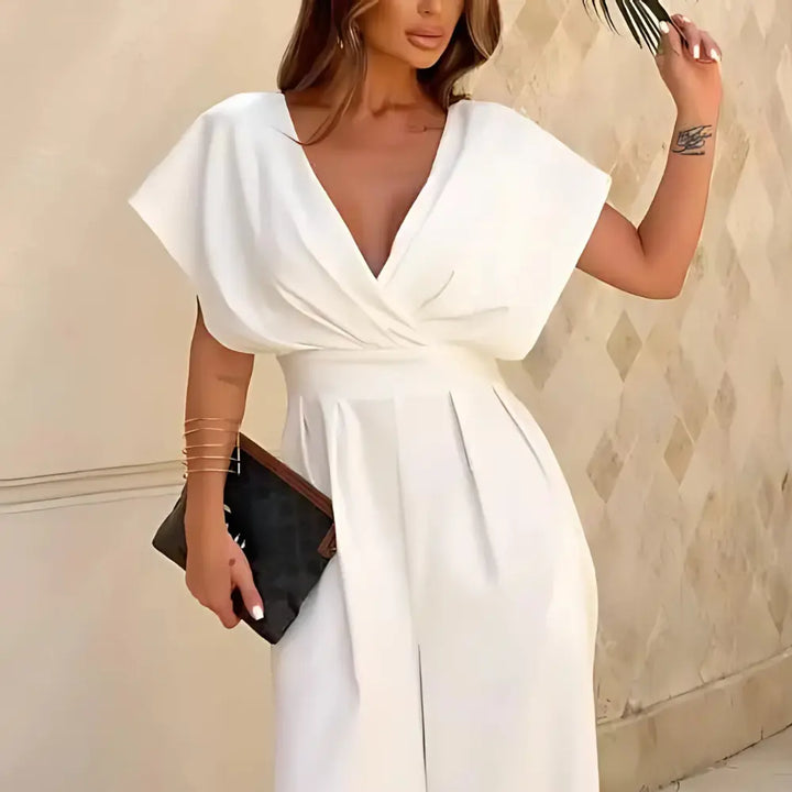 "Combinaison chic jambes larges, coupe fluide et structurée, manches papillon, idéale pour soirée ou événement pro."