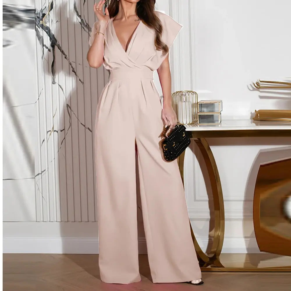 "Combinaison chic jambes larges, coupe fluide et structurée, manches papillon, idéale pour soirée ou événement pro."