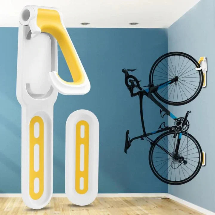 "Crochet mural pour vélo noir et orange, support de rangement vertical optimal, libérant de l'espace au sol."