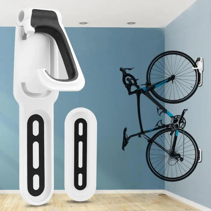 "Crochet mural pour vélo noir et orange, support de rangement vertical optimal, libérant de l'espace au sol."