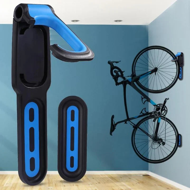 "Crochet mural pour vélo noir et orange, support de rangement vertical optimal, libérant de l'espace au sol."