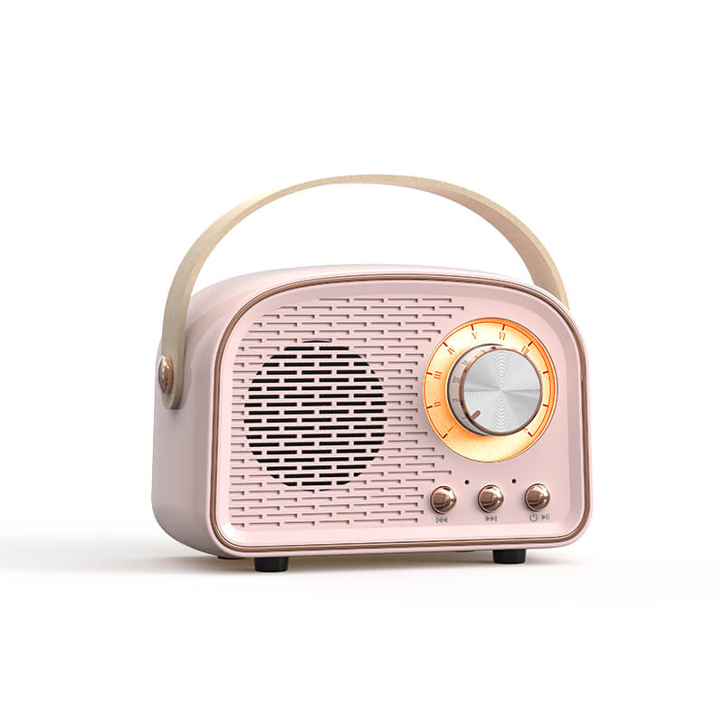 "Enceinte Bluetooth vintage au design rétro, radio FM intégrée, compacte, élégante, son clair, options de couleurs variées."