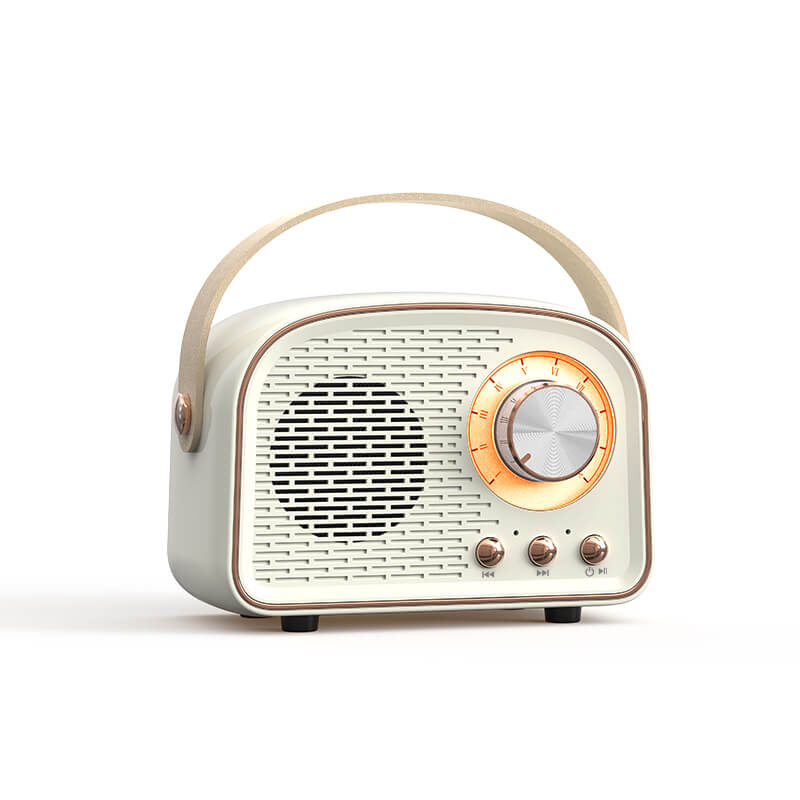 "Enceinte Bluetooth vintage au design rétro, radio FM intégrée, compacte, élégante, son clair, options de couleurs variées."