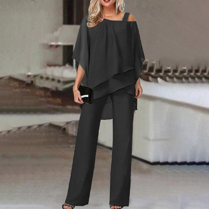 "Ensemble élégant 2 pièces Olivia avec manches batwing, disponible en blanc, bleu, noir, rouge pour occasions spéciales."