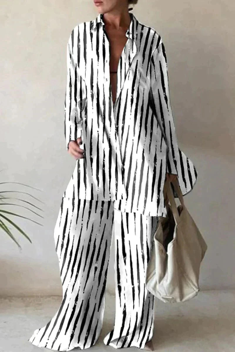 "Ensemble féminin chic avec chemise oversize motif abstrait et pantalon large, look moderne et confortable."