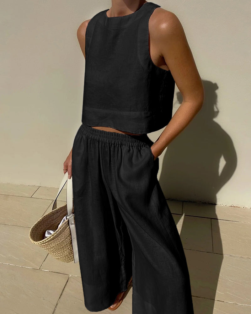 Ensemble femme en lin léger, haut sans manches minimaliste, pantalon large fluide, idéal pour style estival élégant.