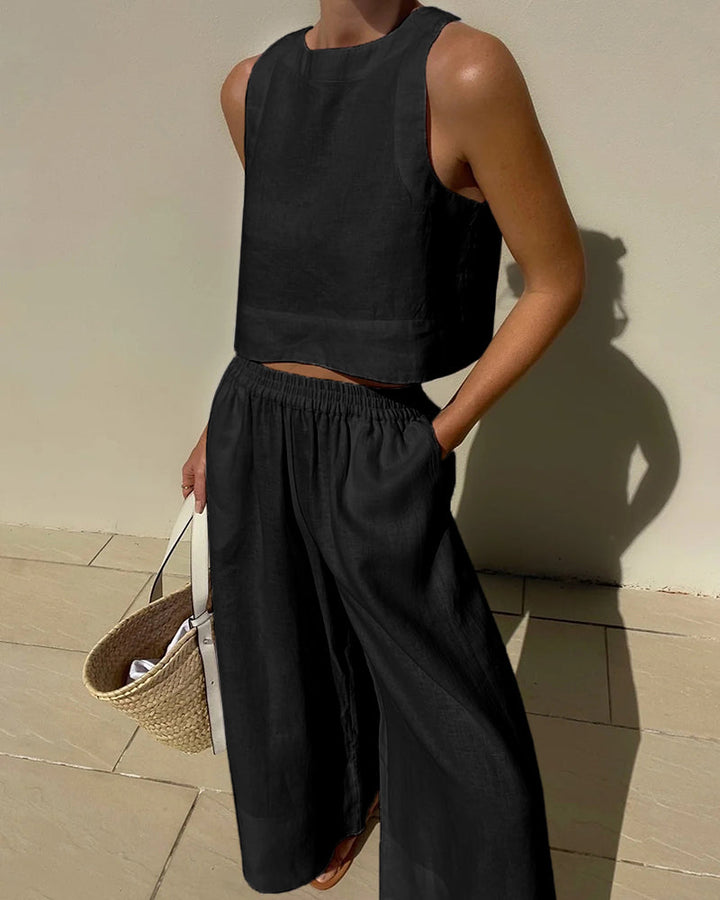 Ensemble femme en lin léger, haut sans manches minimaliste, pantalon large fluide, idéal pour style estival élégant.